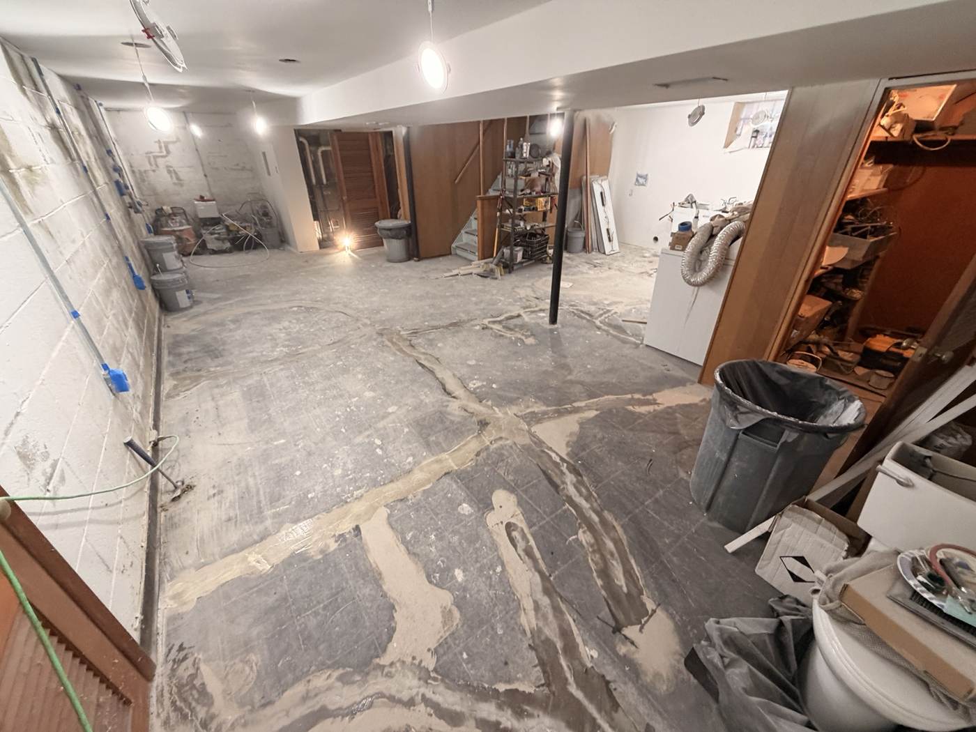 Bare concrete basement floor before coating